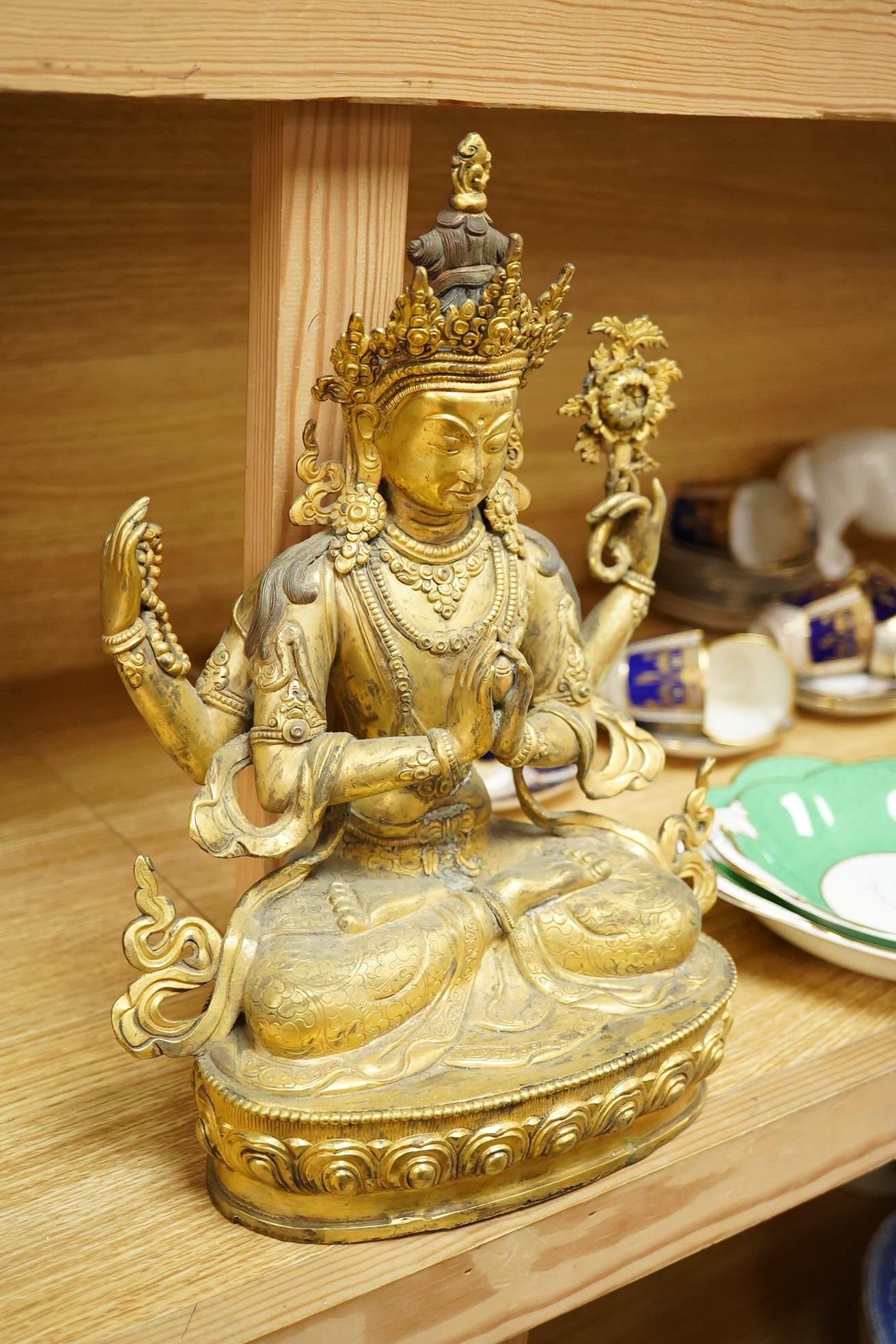 A large Sino Tibetan gilt bronze figure of Avalokiteshvara, 31cm high